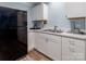 A well-appointed kitchen with stainless steel appliances and white cabinetry is featured at 7417 Shadowlake Dr, Charlotte, NC 28226