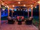 Outdoor space includes a covered patio with lights and outdoor furniture at 7417 Shadowlake Dr, Charlotte, NC 28226