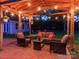 Covered patio is furnished with a ceiling fan and ambient string lights at 7417 Shadowlake Dr, Charlotte, NC 28226