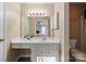Bright bathroom with a vanity, mirror, and ample storage, offering comfort and style at 8220 Terra Linda Ln, Charlotte, NC 28215