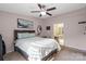 Comfortable bedroom bathed in sunlight, featuring a well-appointed ensuite bathroom for added privacy at 8220 Terra Linda Ln, Charlotte, NC 28215