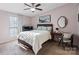 Cozy bedroom featuring a ceiling fan, a double bed, and decor for a relaxing space at 8220 Terra Linda Ln, Charlotte, NC 28215