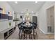 Elegant dining room featuring a stylish table setting, modern lighting, and neutral decor at 8220 Terra Linda Ln, Charlotte, NC 28215