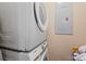 Modern laundry area with stacked washer and dryer units, offering space-saving convenience at 8220 Terra Linda Ln, Charlotte, NC 28215