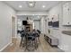 Open-concept living space connecting the dining area and kitchen, creating a seamless flow for modern living at 8220 Terra Linda Ln, Charlotte, NC 28215