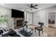 Cozy living room featuring a stone fireplace, neutral tones, and comfortable seating area at 8220 Terra Linda Ln, Charlotte, NC 28215