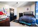 Bright bedroom featuring a large window and dark furniture at 9220 Pinaceal Ct, Charlotte, NC 28215