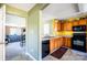 Eat-in kitchen features a black appliance suite and access to the living room at 9220 Pinaceal Ct, Charlotte, NC 28215