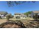 Large backyard showcasing a well-maintained lawn, patio with gazebo, and ample space for recreation at 9895 Travertine Trl, Davidson, NC 28036