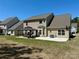 Backyard features a well-maintained lawn, a gazebo, and a basketball hoop at 9895 Travertine Trl, Davidson, NC 28036