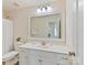 Bright bathroom with white vanity, large mirror, and shower featuring modern fixtures at 9895 Travertine Trl, Davidson, NC 28036