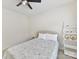 Bedroom featuring a ceiling fan, neutral tones, decorative ladder, and window with blinds at 9895 Travertine Trl, Davidson, NC 28036
