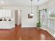 Bright breakfast nook with hardwood floors, large windows, and view to outside at 9895 Travertine Trl, Davidson, NC 28036
