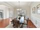 Elegant dining area with tray ceiling, wainscoting, and an abundance of natural light at 9895 Travertine Trl, Davidson, NC 28036