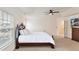 Bedroom with neutral color scheme, tv, and tray ceilings that create an inviting atmosphere at 9895 Travertine Trl, Davidson, NC 28036