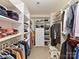 Spacious walk-in closet with custom shelving and ample storage for clothes and accessories at 9895 Travertine Trl, Davidson, NC 28036