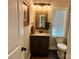 Charming half bathroom with modern fixtures and vanity at 1021 Mccollum Oaks Ln, Monroe, NC 28110