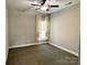 Simple bedroom with neutral colors and carpeted floor at 1021 Mccollum Oaks Ln, Monroe, NC 28110
