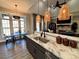 Modern kitchen featuring granite countertops, stainless steel appliances, and stylish pendant lighting at 1021 Mccollum Oaks Ln, Monroe, NC 28110