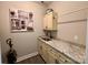 Laundry room with custom cabinets and granite countertop at 1021 Mccollum Oaks Ln, Monroe, NC 28110