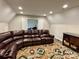 Living room with a large sectional sofa, colorful rug, and recessed lighting at 1021 Mccollum Oaks Ln, Monroe, NC 28110