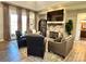 Cozy living room with stone fireplace and large windows at 1021 Mccollum Oaks Ln, Monroe, NC 28110