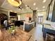 Bright, open-concept living space featuring a kitchen with granite countertops, a dining area, and a cozy living room at 1021 Mccollum Oaks Ln, Monroe, NC 28110