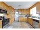 Traditional kitchen with light wood cabinetry, granite countertops, and stainless steel appliances at 103 Perry St, Shelby, NC 28150