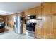 Kitchen featuring stainless steel appliances, light wood cabinets, and tile floors at 103 Perry St, Shelby, NC 28150