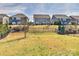 Spacious backyard view with black fence, offering privacy and ample space for activities at 1036 Easley St, Waxhaw, NC 28173