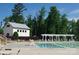 Community swimming pool surrounded by lounge chairs and lush greenery, perfect for relaxation at 1036 Easley St, Waxhaw, NC 28173