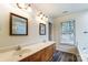 Traditional bathroom with a double vanity and a window for natural light at 10434 Henbane Ct, Charlotte, NC 28213