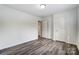 Bright bedroom featuring light colored walls and vinyl flooring at 10434 Henbane Ct, Charlotte, NC 28213