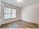 Bedroom with two windows for ample natural light and vinyl floors at 10434 Henbane Ct, Charlotte, NC 28213