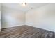Neutral bedroom featuring gray wood floors at 10434 Henbane Ct, Charlotte, NC 28213