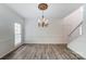 Formal dining area with a decorative chandelier and lots of natural light at 10434 Henbane Ct, Charlotte, NC 28213