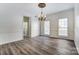 Formal dining area with a decorative chandelier and lots of natural light at 10434 Henbane Ct, Charlotte, NC 28213