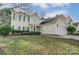 Traditional home with a well-manicured lawn and two-car garage at 10434 Henbane Ct, Charlotte, NC 28213