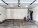 Spacious two-car garage with concrete floor, water heater, and ample room for parking and storage at 10434 Henbane Ct, Charlotte, NC 28213