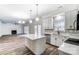 Open-concept kitchen with a center island that connects to the Gathering room at 10434 Henbane Ct, Charlotte, NC 28213