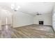 Open concept living room with a gas fireplace at 10434 Henbane Ct, Charlotte, NC 28213