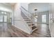 View of the staircase with wood steps and white risers at 10434 Henbane Ct, Charlotte, NC 28213