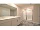 Bathroom boasts double sink vanity, tile floors, and glass enclosed shower at 1059 Horizon St, Chester, SC 29706