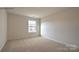 Bedroom with large window offering natural light, and plush carpeting at 1059 Horizon St, Chester, SC 29706
