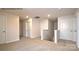 Upstairs hallway, neutral carpet, multiple white doors, with a staircase to the lower level at 1059 Horizon St, Chester, SC 29706