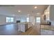 Open-concept kitchen flows into the spacious living room, featuring a fireplace and large windows at 1059 Horizon St, Chester, SC 29706