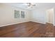 Bedroom featuring hardwood floors, ceiling fan and large windows at 107 S Laurel Ave # 101A, Charlotte, NC 28207