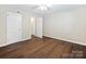 Cozy bedroom featuring hardwood floors and a neutral color scheme at 107 S Laurel Ave # 101A, Charlotte, NC 28207