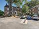 Classic brick building with mature trees, offering charm and curb appeal at 107 S Laurel Ave # 101A, Charlotte, NC 28207