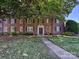 Well-maintained brick building with landscaped lawn providing a welcoming feel at 107 S Laurel Ave # 101A, Charlotte, NC 28207